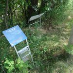 Installed artwork was moved to ditch by vandals.
