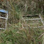 Installed artwork was moved to ditch by vandals.